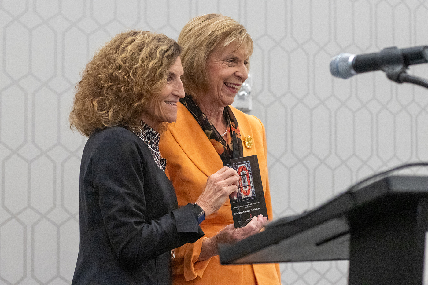 Tanny Crane, president and CEO of Crane Group, left, stands next to Ohio First Lady Fran DeWine, while both women hold a plaque that Crane presented to DeWine as the recipient of a Crane Excellence in Early Childhood Award.