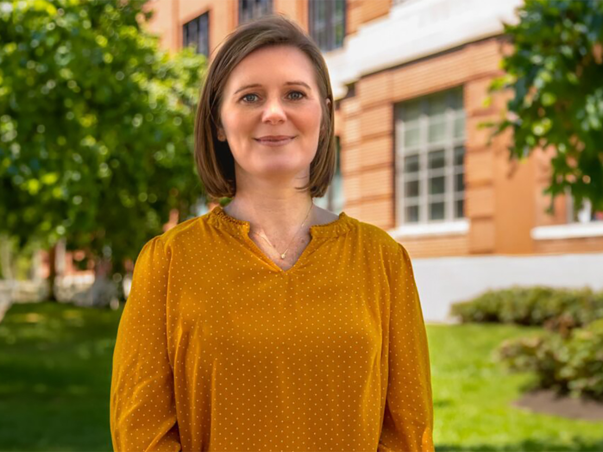 Dr. Shayne Piasta, professor of Literacies, Literature, and Learning in the Department of Teaching and Learning at The Ohio State University, stands in front of Arps Hall on the Ohio State campus.