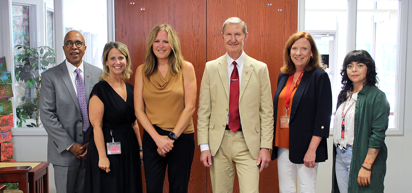 Standing from left to right are Ohio State University College of Education and Human Ecology Dean Don Pope-Davis, A. Sophie Rogers School Principal Anneliese Johnson, Crane and Schoenbaum Executive Director Laura Justice, Ohio State University President Walter “Ted” Carter, Early Head Start Partnership Program Director Sherrie Sutton, and Crane and Schoenbaum Associate Director of Policy & External Affairs Jamie O’Leary.