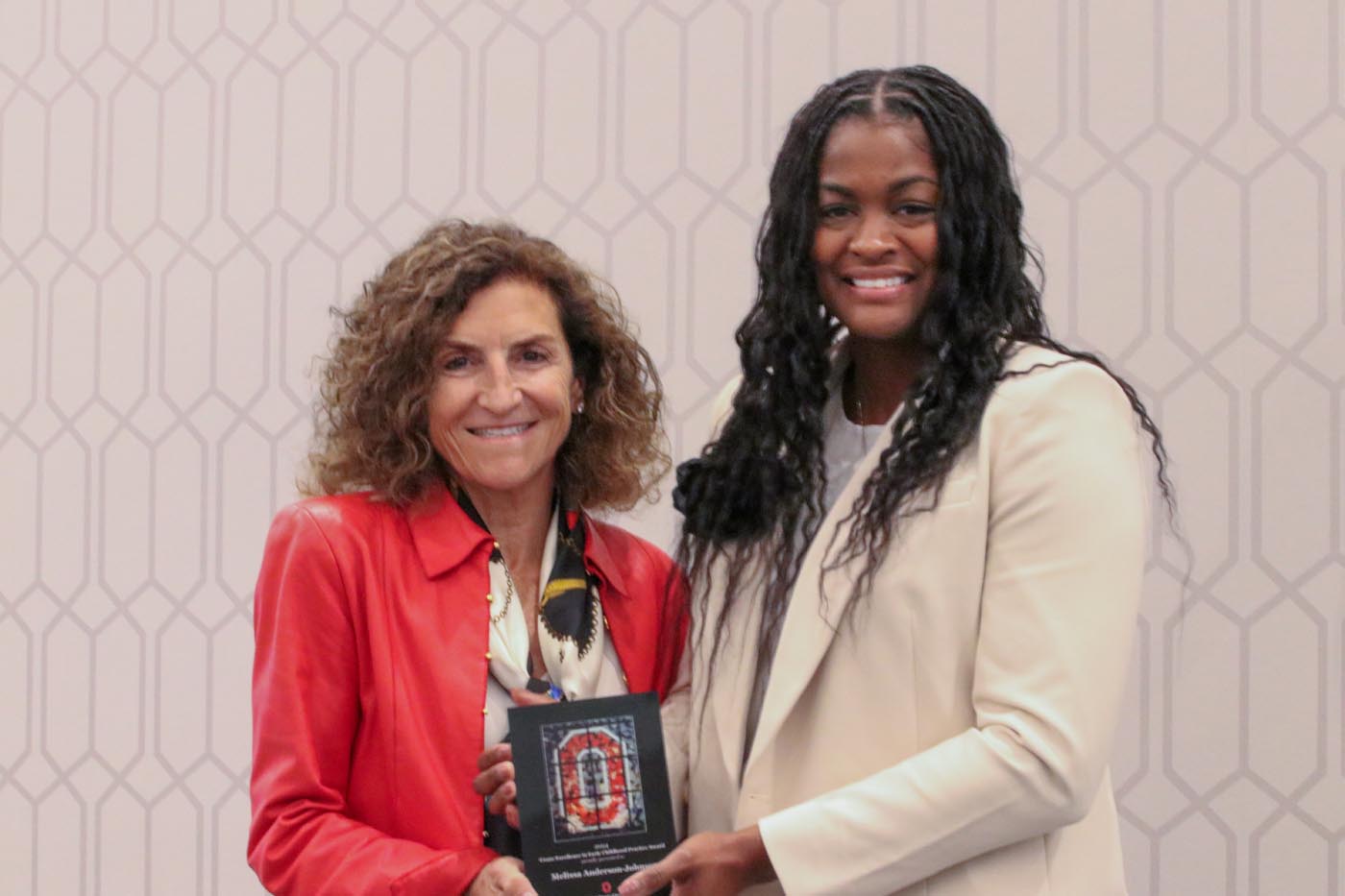 Tanny Crane, left, stands with Melissa Anderson-Johnson, the recipient of the Crane Excellence in Early Childhood Award for Practice.