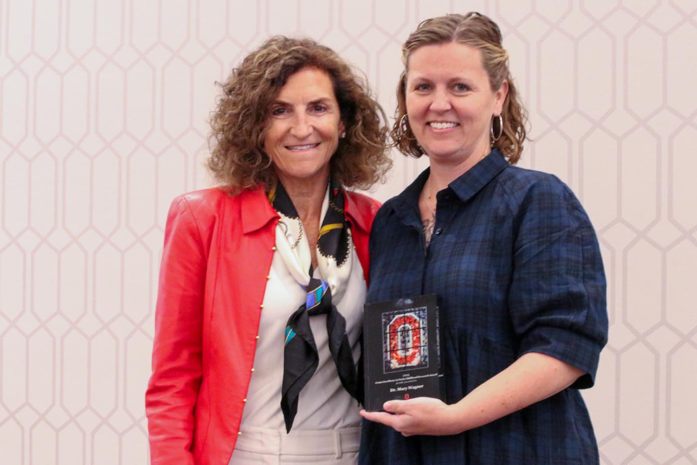 Tanny Crane, left, stands with Dr. Mary Wagner, the recipient of the Crane Excellence in Early Childhood Award for Research.