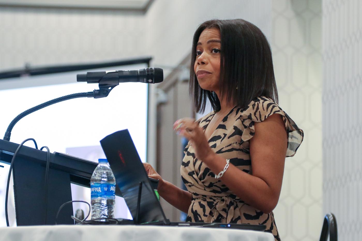 Franklin County Commissioner Erica Crawley speaks at a podium.