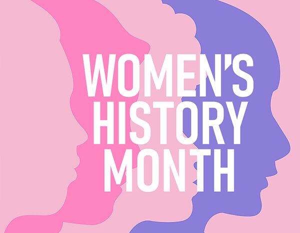 An illustration showing the silhouette profiles of various women's heads in shades of pink, fuchsia and blue, along with the words "MARCH IS WOMEN'S HISTORY MONTH"